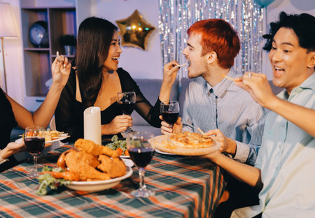 Diversity, dinner and group of people toast celebration together at party. Friends, happy and celebrate with food, wine and friendship for love, support and cheers champagne at business functionの写真素材