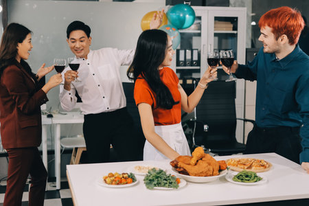 Diversity, dinner and group of people toast celebration together at party. Friends, happy and celebrate with food, wine and friendship for love, support and cheers champagne at business functionの写真素材