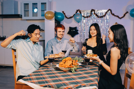 Diversity, dinner and group of people toast celebration together at party. Friends, happy and celebrate with food, wine and friendship for love, support and cheers champagne at business functionの写真素材