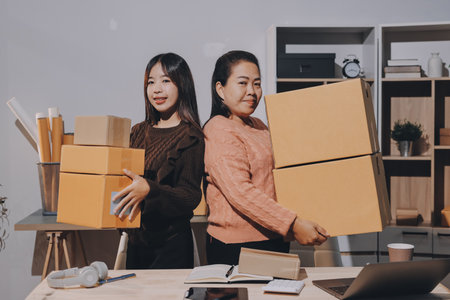 Asian woman selling clothes on camera live broadcast on social network at home, Online selling clothes on social media. Blogger woman influencer, SME retail store owner.の写真素材