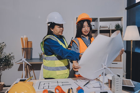 Architects and engineers working collaboratively on construction project