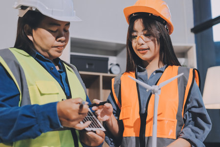 Architects and engineers working collaboratively on construction projectの写真素材