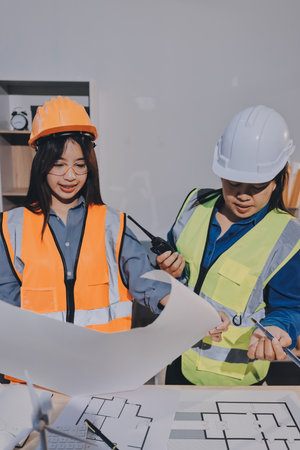 Architects and engineers working collaboratively on construction projectの写真素材