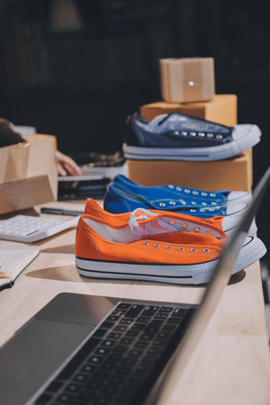 Asian woman describe selling clothes on camera live broadcast on social network at home, Online selling clothes on social media. Blogger woman influencer, SME retail store owner.の写真素材