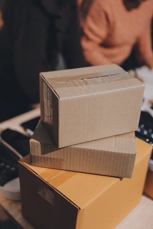 Asian woman selling clothes on camera live broadcast on social network at home, Online selling clothes on social media. Blogger woman influencer, SME retail store owner.の写真素材