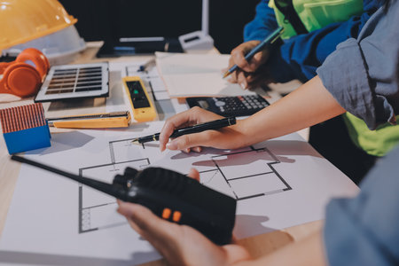 Architects and engineers working collaboratively on construction projectの写真素材