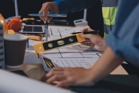 Architects and engineers working collaboratively on construction projectの写真素材