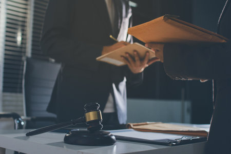 Lawyer explained to the client about the law that must be brought against the court case.の写真素材