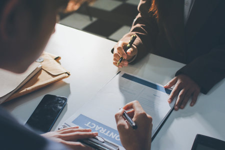 Lawyer explained to the client about the law that must be brought against the court case.の写真素材