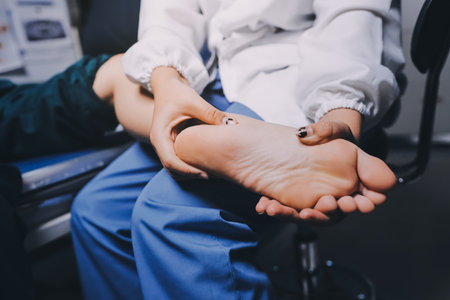 Rehabilitation therapy Professional male physiotherapists working in rehabilitation centers while treating male patients with leg and muscle pain.の写真素材