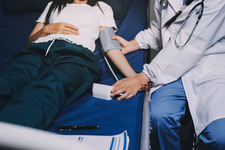 Nurse measuring blood pressure of elderly woman, closeup. Assisting senior generationの写真素材