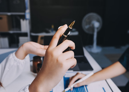 Group of doctors attending seminar in hospital lecture hall with senior physician giving medical presentation and professional training session on healthcare practicesの写真素材