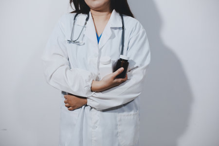 The pharmacist or doctor holding medication or medicine for treatment. Antibiotic pill in the vial.の写真素材