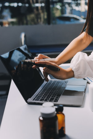 Group of doctors attending seminar in hospital lecture hall with senior physician giving medical presentation and professional training session on healthcare practicesの写真素材