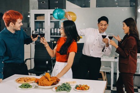 Diversity, dinner and group of people toast celebration together at party. Friends, happy and celebrate with food, wine and friendship for love, support and cheers champagne at business functionの写真素材