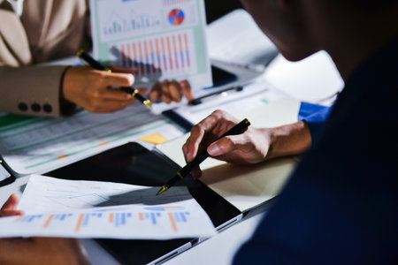 business people in meeting discussing plans togetherの写真素材