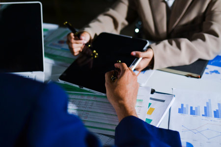 business people in meeting discussing plans togetherの写真素材