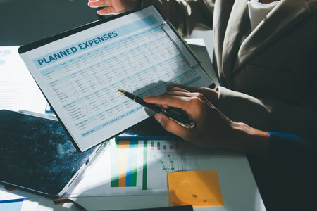 Business Team Analyzing Financial Data in Modern Officeの写真素材