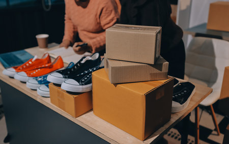 Asian woman describe selling clothes on camera live broadcast on social network at home, Online selling clothes on social media. Blogger woman influencer, SME retail store owner.の写真素材