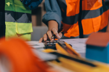 Architects and engineers working collaboratively on construction projectの写真素材