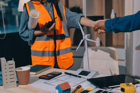 Architects and engineers working collaboratively on construction projectの写真素材