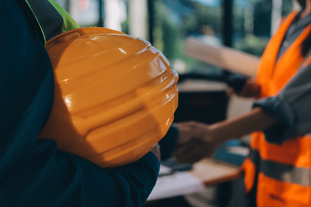 Architects and engineers working collaboratively on construction projectの写真素材