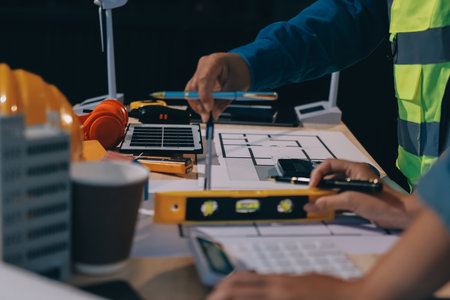 Architects and engineers working collaboratively on construction projectの写真素材