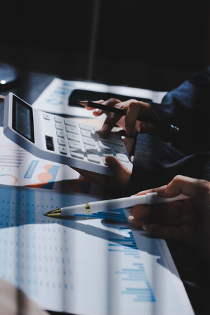 Close up high angle Asian businesswoman working with her coworker in meeting roomの写真素材