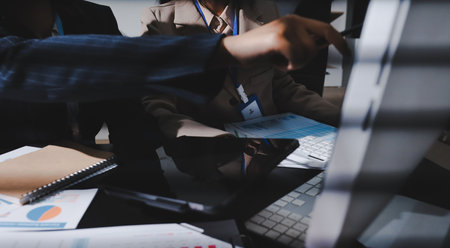 Close up high angle Asian businesswoman working with her coworker in meeting roomの写真素材