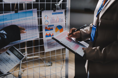 Close up high angle Asian businesswoman working with her coworker in meeting roomの写真素材