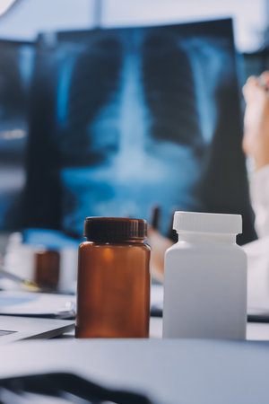 Group of doctors attending seminar in hospital lecture hall with senior physician giving medical presentation and professional training session on healthcare practicesの写真素材