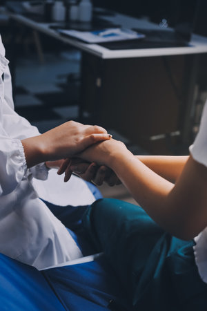 Doctor giving hope. Close up shot of young female physician leaning forward to smiling elderly lady...