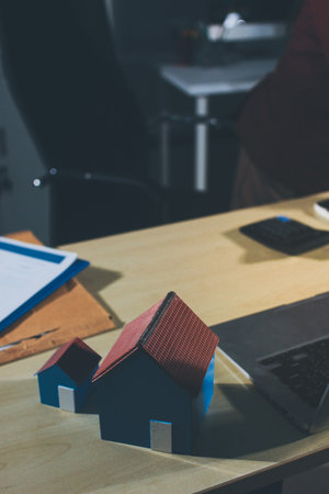 Customer signing a real estate contract in real estate agency.の写真素材