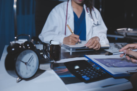 Doctors are meeting at the hospital to discuss treatment options and share experiences with colleagues.の写真素材