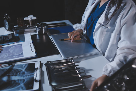 Doctors are meeting at the hospital to discuss treatment options and share experiences with colleagues.の写真素材