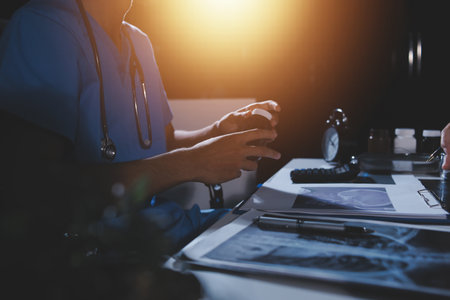 Doctors are meeting at the hospital to discuss treatment options and share experiences with colleagues.の写真素材