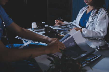 Doctors are meeting at the hospital to discuss treatment options and share experiences with colleagues.の写真素材
