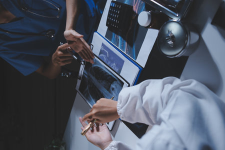 Doctors are meeting at the hospital to discuss treatment options and share experiences with colleagues.の写真素材