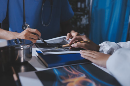 Doctors are meeting at the hospital to discuss treatment options and share experiences with colleagues.の写真素材
