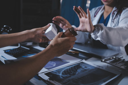 Doctors are meeting at the hospital to discuss treatment options and share experiences with colleagues.の写真素材