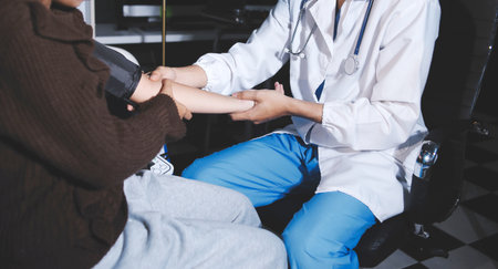 The doctor measures blood pressure to the patientの写真素材