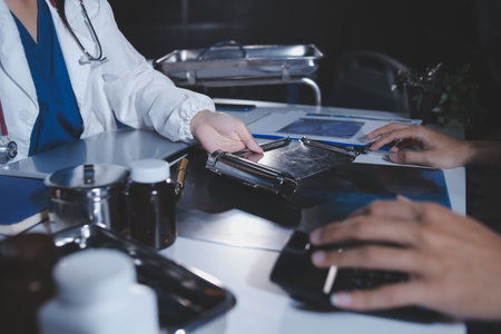 Doctors are meeting at the hospital to discuss treatment options and share experiences with colleagues.の写真素材