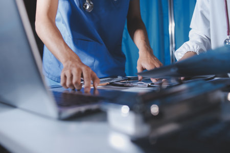 Doctors are meeting at the hospital to discuss treatment options and share experiences with colleagues.の写真素材