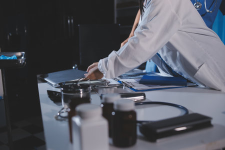 Doctors are meeting at the hospital to discuss treatment options and share experiences with colleagues.の写真素材