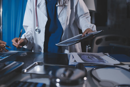 Doctors are meeting at the hospital to discuss treatment options and share experiences with colleagues.の写真素材