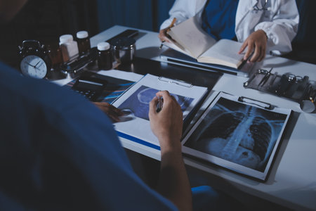 Doctors are meeting at the hospital to discuss treatment options and share experiences with colleagues.の写真素材