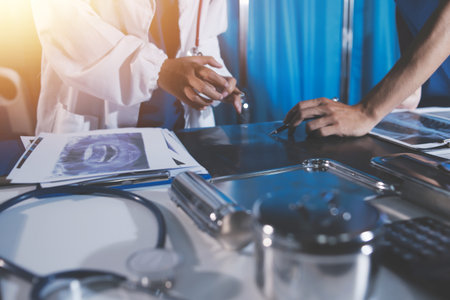 Doctors are meeting at the hospital to discuss treatment options and share experiences with colleagues.の写真素材