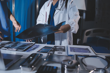 Doctors are meeting at the hospital to discuss treatment options and share experiences with colleagues.の写真素材