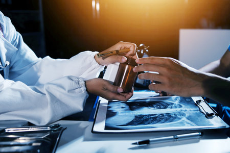 Doctors are meeting at the hospital to discuss treatment options and share experiences with colleagues.の写真素材