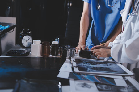 Doctors are meeting at the hospital to discuss treatment options and share experiences with colleagues.の写真素材